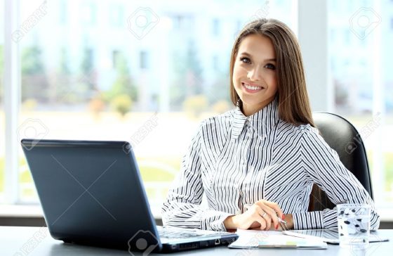 50162938-business-woman-working-on-laptop-computer-at-office